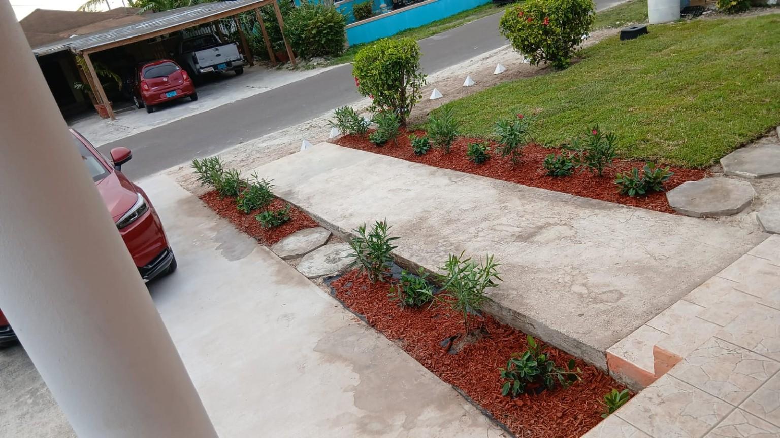 Finished landscaping with mulch and walkway by KJ Landscaping General Maintenance